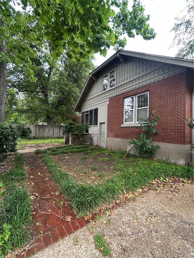 301 N Everett St, Kennett, MO 63857 - view of side of property with brick siding