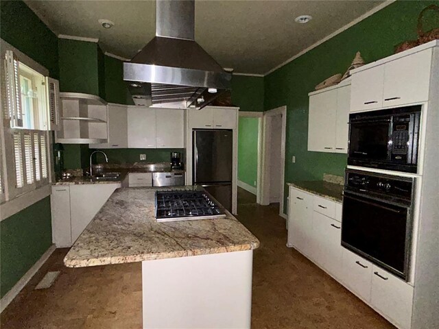 301 N Everett St, Kennett, MO 63857 - kitchen featuring black appliances, island range hood, open shelves, a sink, and a center island