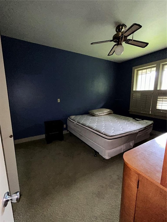 301 N Everett St, Kennett, MO 63857 - bedroom with carpet, baseboards, and ceiling fan
