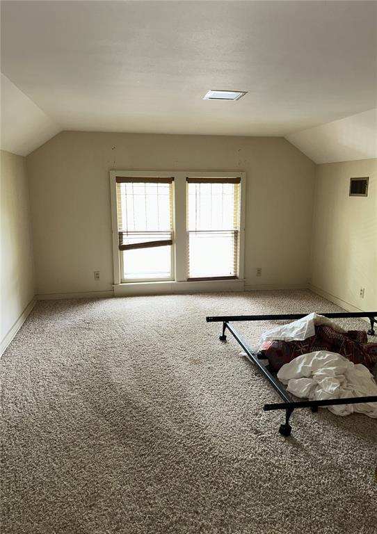 301 N Everett St, Kennett, MO 63857 - bonus room featuring vaulted ceiling, carpet flooring, and baseboards