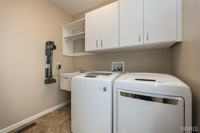 1510 Kennabrooke Ct, Saint Louis, MO 63146 - laundry room featuring cabinet space, independent washer and dryer, and light tile patterned floors