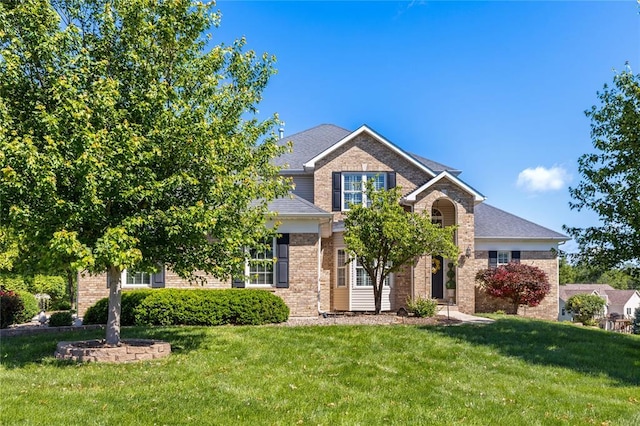 5360 Tower Hill Ct, Weldon Spring, MO 63304 - traditional-style home featuring a front lawn and brick siding