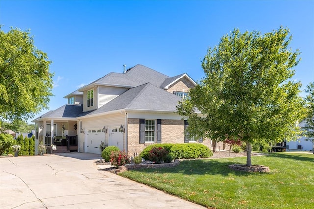 5360 Tower Hill Ct, Weldon Spring, MO 63304 - view of front of home with a front yard, an attached garage, brick siding, and driveway