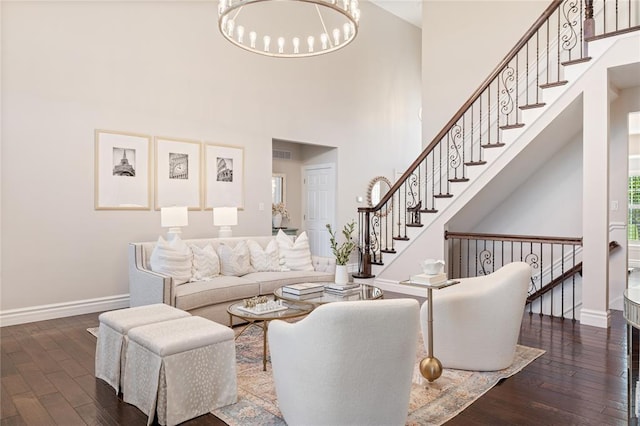 5360 Tower Hill Ct, Weldon Spring, MO 63304 - living room with wood finished floors, baseboards, a chandelier, a high ceiling, and stairway