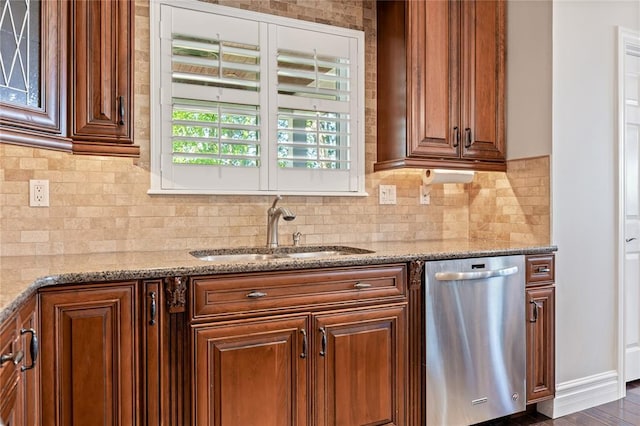 5360 Tower Hill Ct, Weldon Spring, MO 63304 - kitchen with stainless steel dishwasher, a sink, light stone counters, and tasteful backsplash