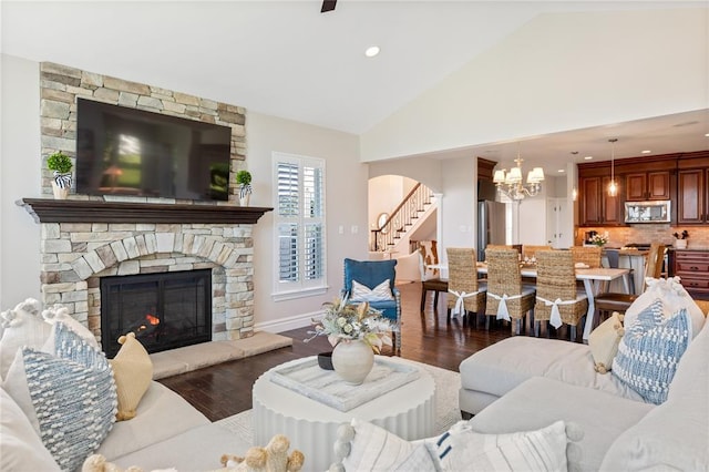 5360 Tower Hill Ct, Weldon Spring, MO 63304 - living room with stairs, dark wood-type flooring, a chandelier, vaulted ceiling, and a fireplace