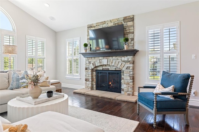 5360 Tower Hill Ct, Weldon Spring, MO 63304 - living room with healthy amount of natural light, dark wood-style flooring, a fireplace, lofted ceiling, and baseboards