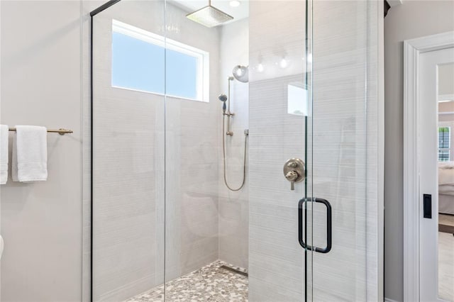 5360 Tower Hill Ct, Weldon Spring, MO 63304 - ensuite bathroom featuring a stall shower and healthy amount of natural light