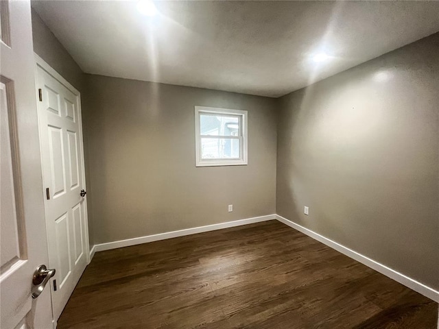 408 E Monroe St, Paris, MO 65275 - unfurnished room with dark wood-style floors and baseboards