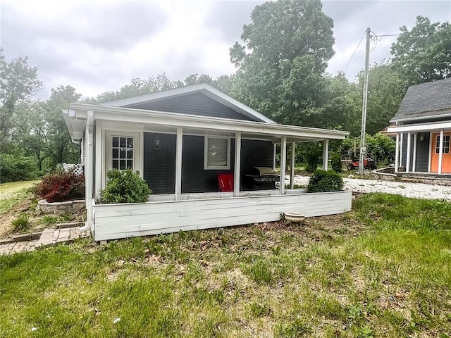 408 E Monroe St, Paris, MO 65275 - rear view of house featuring covered porch