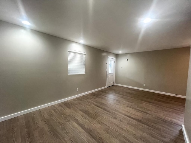 408 E Monroe St, Paris, MO 65275 - unfurnished room featuring dark wood-type flooring, baseboards, and recessed lighting