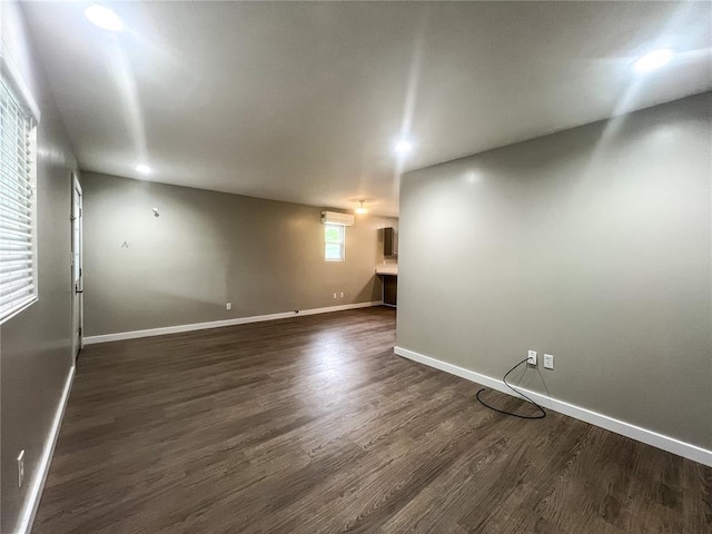 408 E Monroe St, Paris, MO 65275 - spare room with dark wood-type flooring and baseboards
