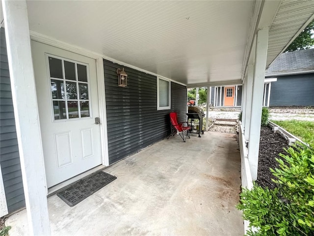408 E Monroe St, Paris, MO 65275 - porch featuring grilling area and an attached carport