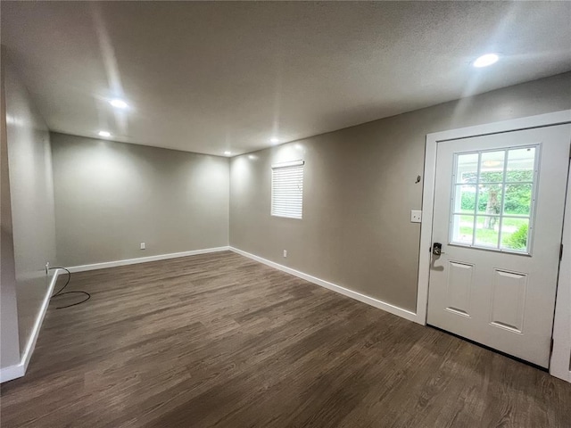 408 E Monroe St, Paris, MO 65275 - unfurnished room with dark wood-type flooring, plenty of natural light, recessed lighting, and baseboards
