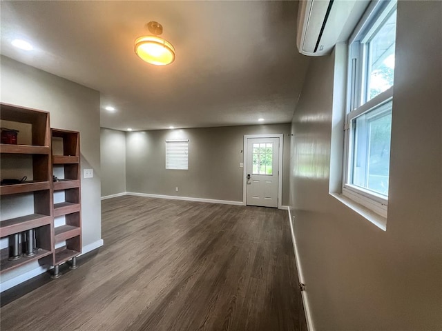 408 E Monroe St, Paris, MO 65275 - entrance foyer with dark wood-style flooring, baseboards, a wall mounted air conditioner, and recessed lighting