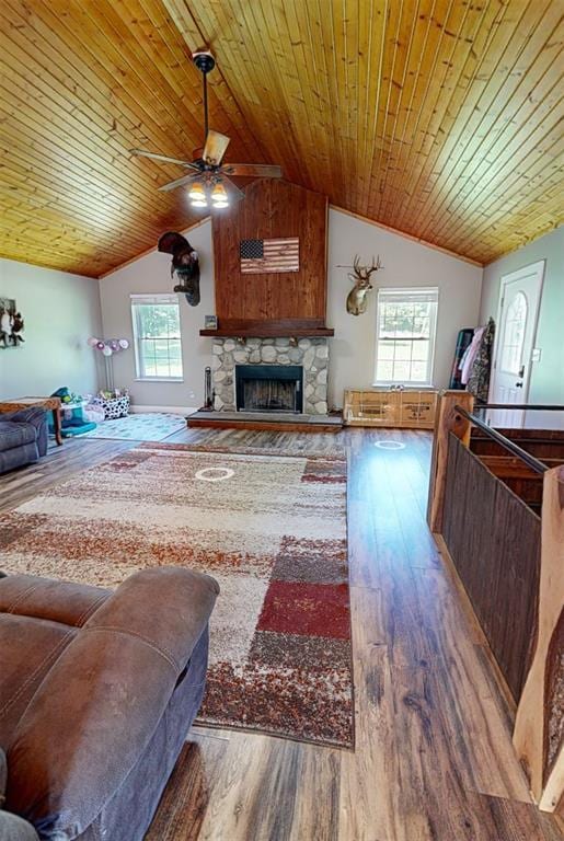 3828 Peters Ford Rd, Leslie, MO 63056 - living room featuring lofted ceiling, ceiling fan, wood finished floors, a fireplace, and wooden ceiling
