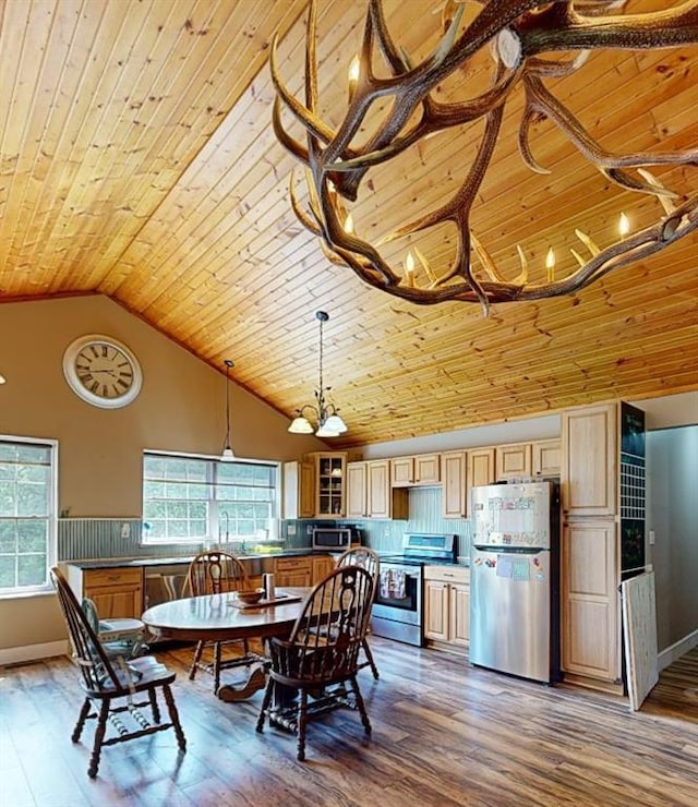 3828 Peters Ford Rd, Leslie, MO 63056 - dining space with wood-type flooring, wooden ceiling, plenty of natural light, and high vaulted ceiling