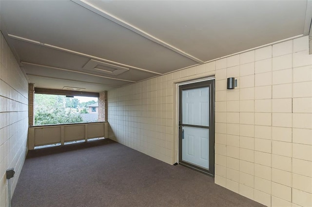 2 Fairways Cir Unit G, Saint Charles, MO 63303 - empty room featuring tile walls and dark carpet