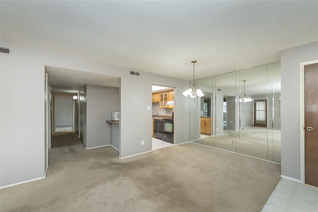 2 Fairways Cir Unit G, Saint Charles, MO 63303 - unfurnished dining area with a chandelier, baseboards, a sink, and carpet