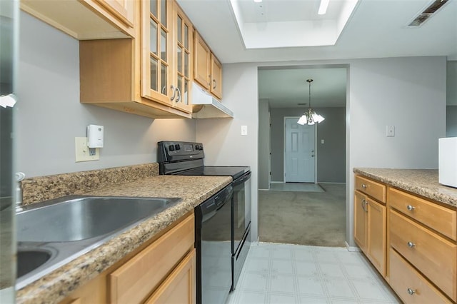 2 Fairways Cir Unit G, Saint Charles, MO 63303 - kitchen featuring black appliances, under cabinet range hood, glass insert cabinets, hanging light fixtures, and light countertops