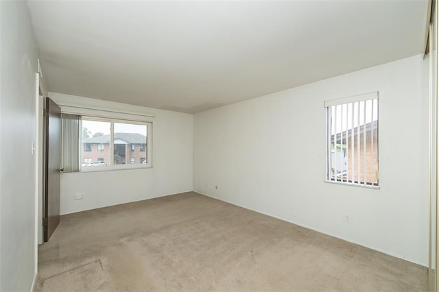 2 Fairways Cir Unit G, Saint Charles, MO 63303 - spare room with light colored carpet