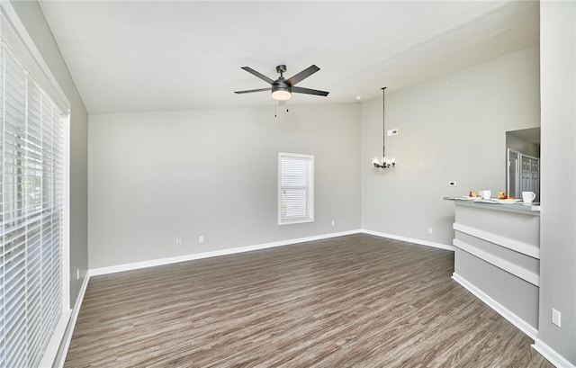 630 Homerun Dr Unit 12N, Ofallon, MO 63366 - unfurnished living room featuring lofted ceiling, dark wood-style flooring, ceiling fan, a chandelier, and baseboards