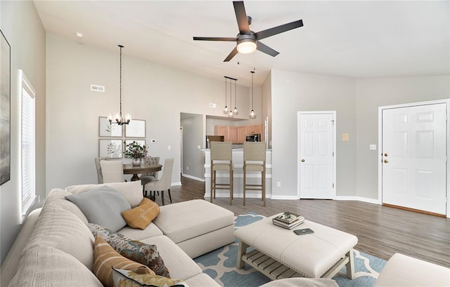 630 Homerun Dr Unit 12N, Ofallon, MO 63366 - living room featuring a chandelier, high vaulted ceiling, ceiling fan, dark wood-style flooring, and baseboards