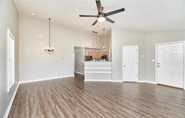 630 Homerun Dr Unit 12N, Ofallon, MO 63366 - unfurnished living room with high vaulted ceiling, a chandelier, wood finished floors, ceiling fan, and baseboards