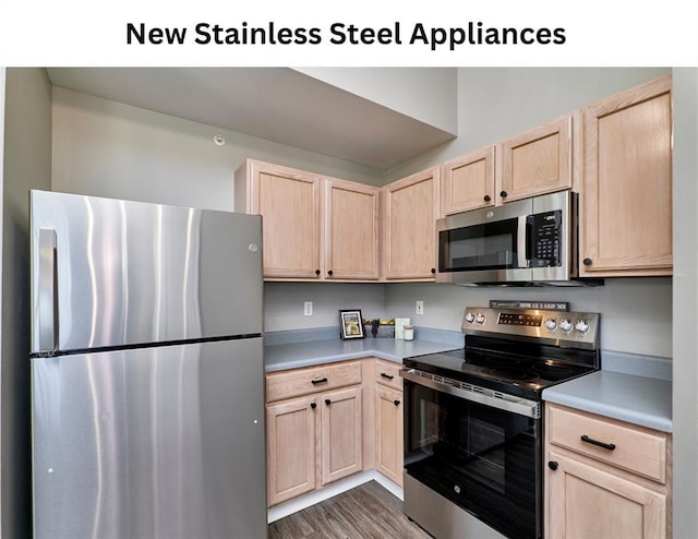 630 Homerun Dr Unit 12N, Ofallon, MO 63366 - kitchen featuring stainless steel appliances, light brown cabinetry, light countertops, and dark wood-style flooring