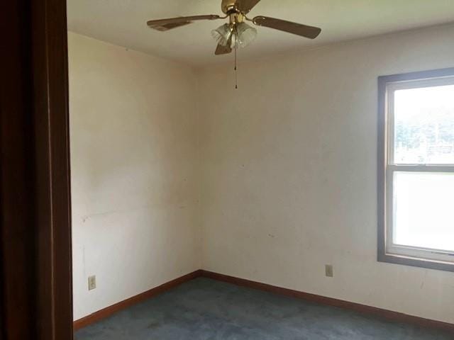 506 W Main St, Matthews, MO 63867 - empty room with healthy amount of natural light, carpet flooring, baseboards, and ceiling fan