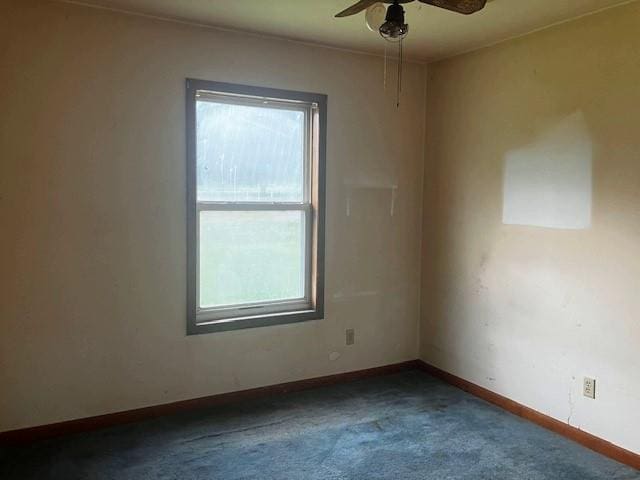 506 W Main St, Matthews, MO 63867 - empty room with plenty of natural light, carpet flooring, a ceiling fan, and baseboards