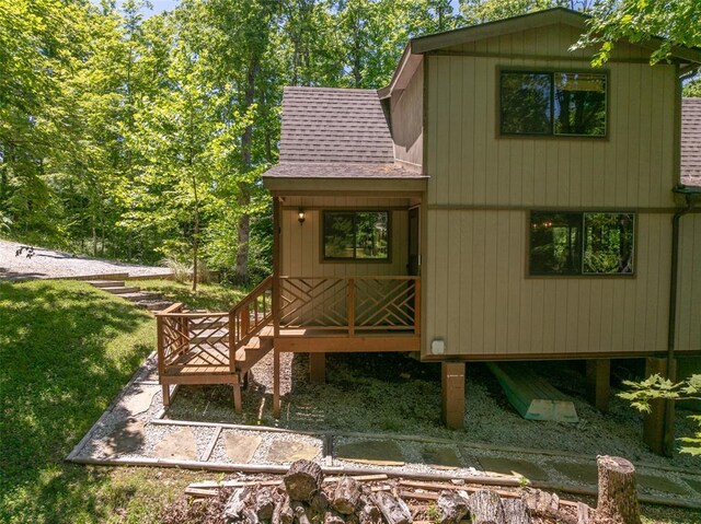 2349 Trautwein Dr, Innsbrook, MO 63390 - view of side of property with a shingled roof and a wooden deck