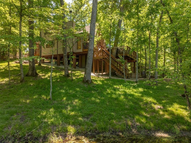 2349 Trautwein Dr, Innsbrook, MO 63390 - view of green lawn with stairs and a wooden deck