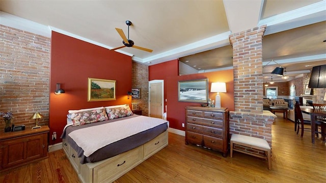 1107 N 2nd St, Saint Charles, MO 63301 - bedroom with ornate columns, wood finished floors, and baseboards