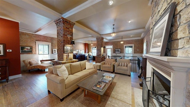 1107 N 2nd St, Saint Charles, MO 63301 - living room with ornate columns, a fireplace, wood finished floors, beamed ceiling, and crown molding