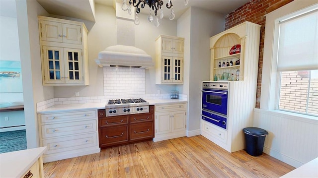 1107 N 2nd St, Saint Charles, MO 63301 - kitchen featuring stainless steel gas cooktop, wall oven, a warming drawer, and light countertops