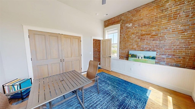 1107 N 2nd St, Saint Charles, MO 63301 - office featuring wood finished floors, brick wall, a wainscoted wall, and ceiling fan