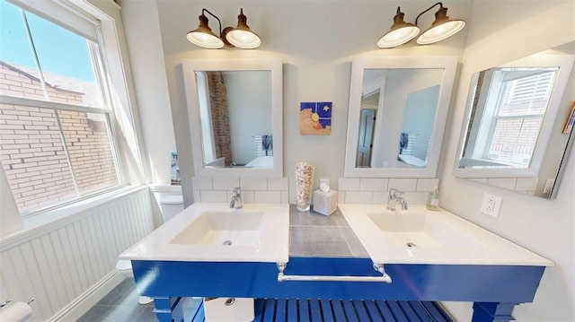 1107 N 2nd St, Saint Charles, MO 63301 - bathroom featuring wainscoting