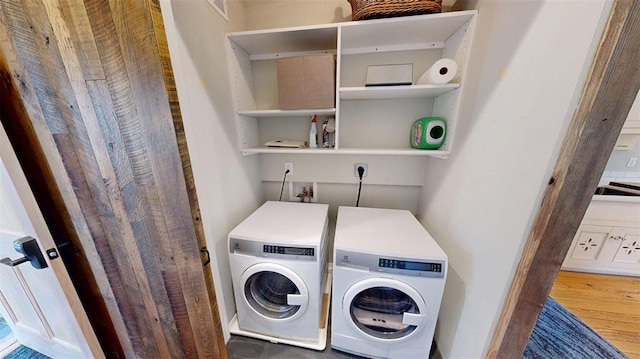 1107 N 2nd St, Saint Charles, MO 63301 - laundry area with independent washer and dryer and wood finished floors