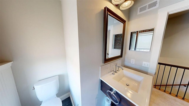 1107 N 2nd St, Saint Charles, MO 63301 - half bath featuring toilet, vanity, and baseboards