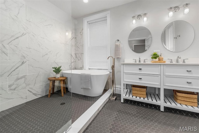 6014 Westminster Pl, Saint Louis, MO 63112 - full bathroom with double vanity, a soaking tub, a shower, and recessed lighting