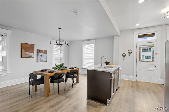 6014 Westminster Pl, Saint Louis, MO 63112 - dining area featuring light wood-style floors, baseboards, recessed lighting, and a chandelier