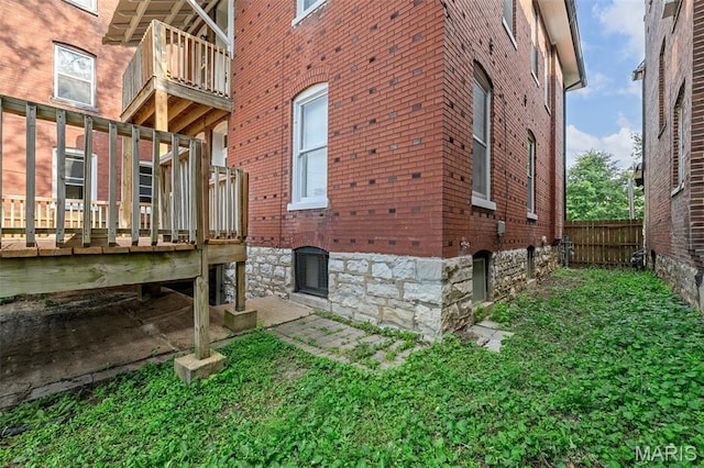 6014 Westminster Pl, Saint Louis, MO 63112 - view of property exterior with brick siding and a deck