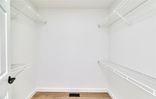 7219 Watsons Parish Dr, Ofallon, MO 63368 - walk in closet featuring light wood finished floors