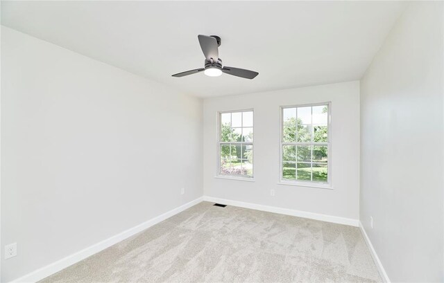 7219 Watsons Parish Dr, Ofallon, MO 63368 - unfurnished room with light colored carpet, baseboards, and a ceiling fan