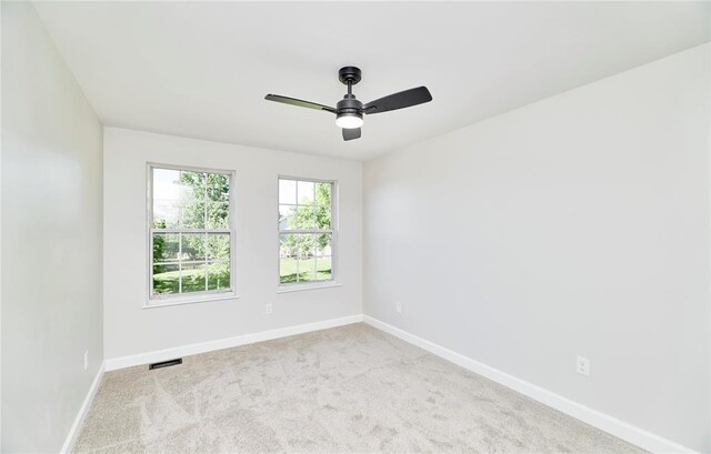 7219 Watsons Parish Dr, Ofallon, MO 63368 - spare room with baseboards, a ceiling fan, and carpet