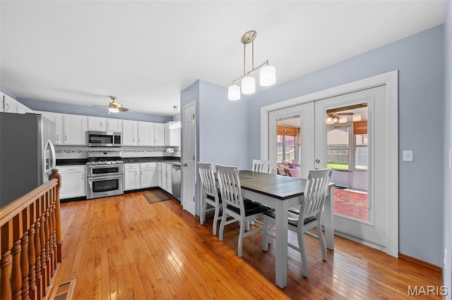 3060 Almond Tree Dr, Saint Peters, MO 63376 - dining room featuring ceiling fan, light wood finished floors, and french doors