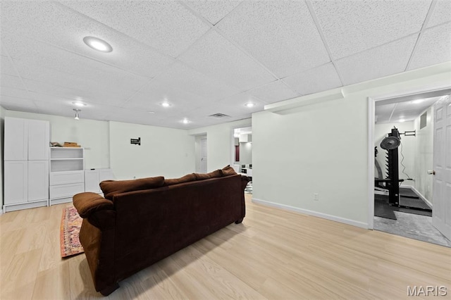 3060 Almond Tree Dr, Saint Peters, MO 63376 - living room featuring light wood-style flooring, a drop ceiling, and recessed lighting