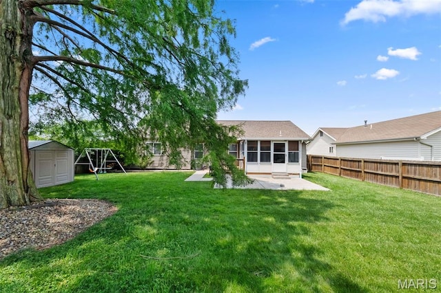 3060 Almond Tree Dr, Saint Peters, MO 63376 - back of house featuring a patio area, a storage shed, a sunroom, and a fenced backyard