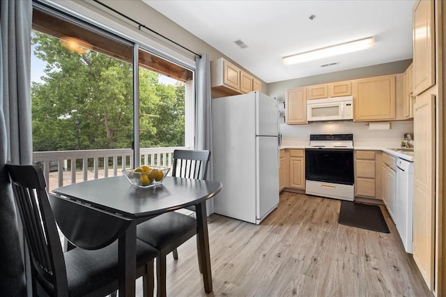 100 Jubilee Hill Dr Unit G, Wildwood, MO 63040 - kitchen with white appliances, light brown cabinetry, light wood-style floors, light countertops, and backsplash